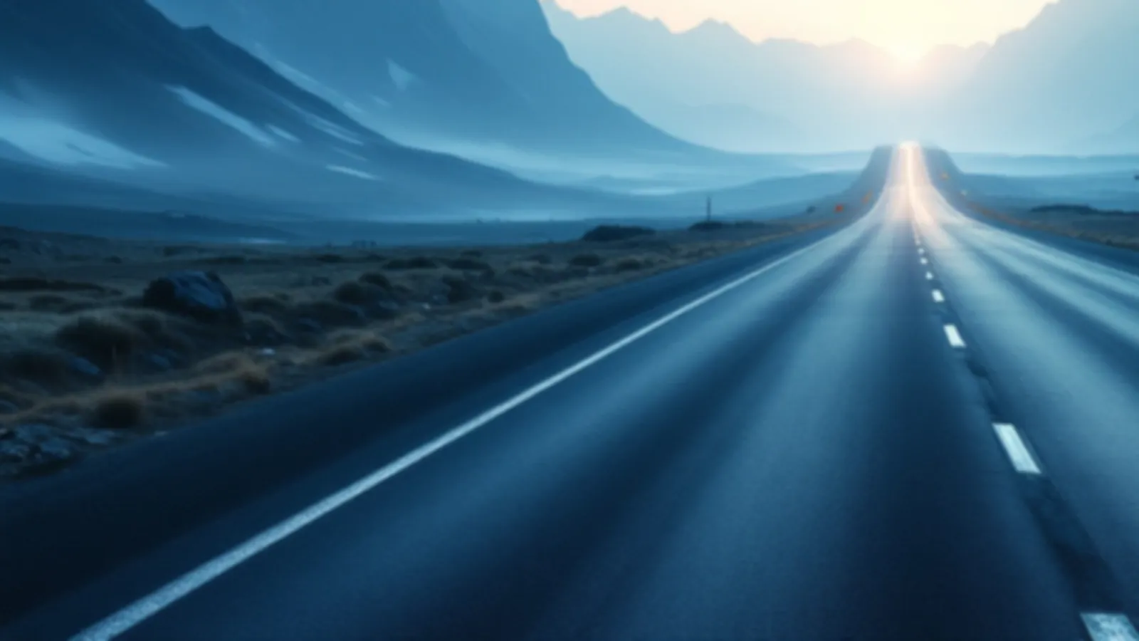 An empty mountain pass road with peaks on both sides under a clear morning sky, the MileageYield view of bad credit loans online, $100 – $5,000